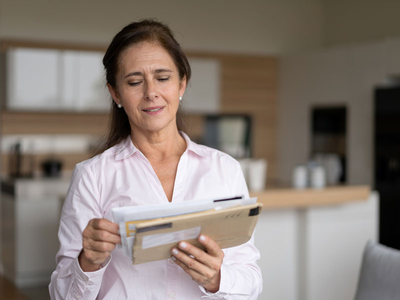 woman looking at mail